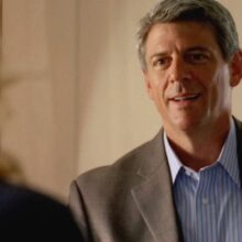 Ted Beneke speaking with a woman