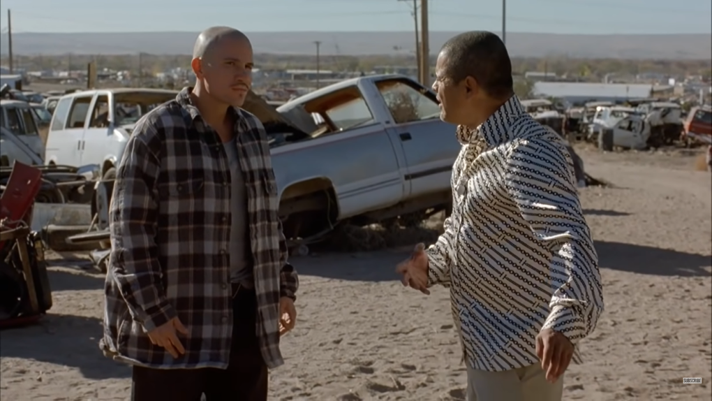 Tuco Salamanca and a man in a shirt standing on the car dump